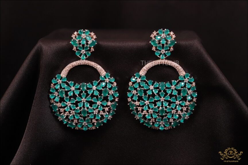 Beautiful flowery Emerald green earrings with zircons -