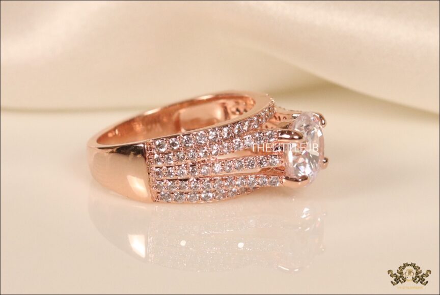 Lustrous rose gold band with sized solitaire – The Little