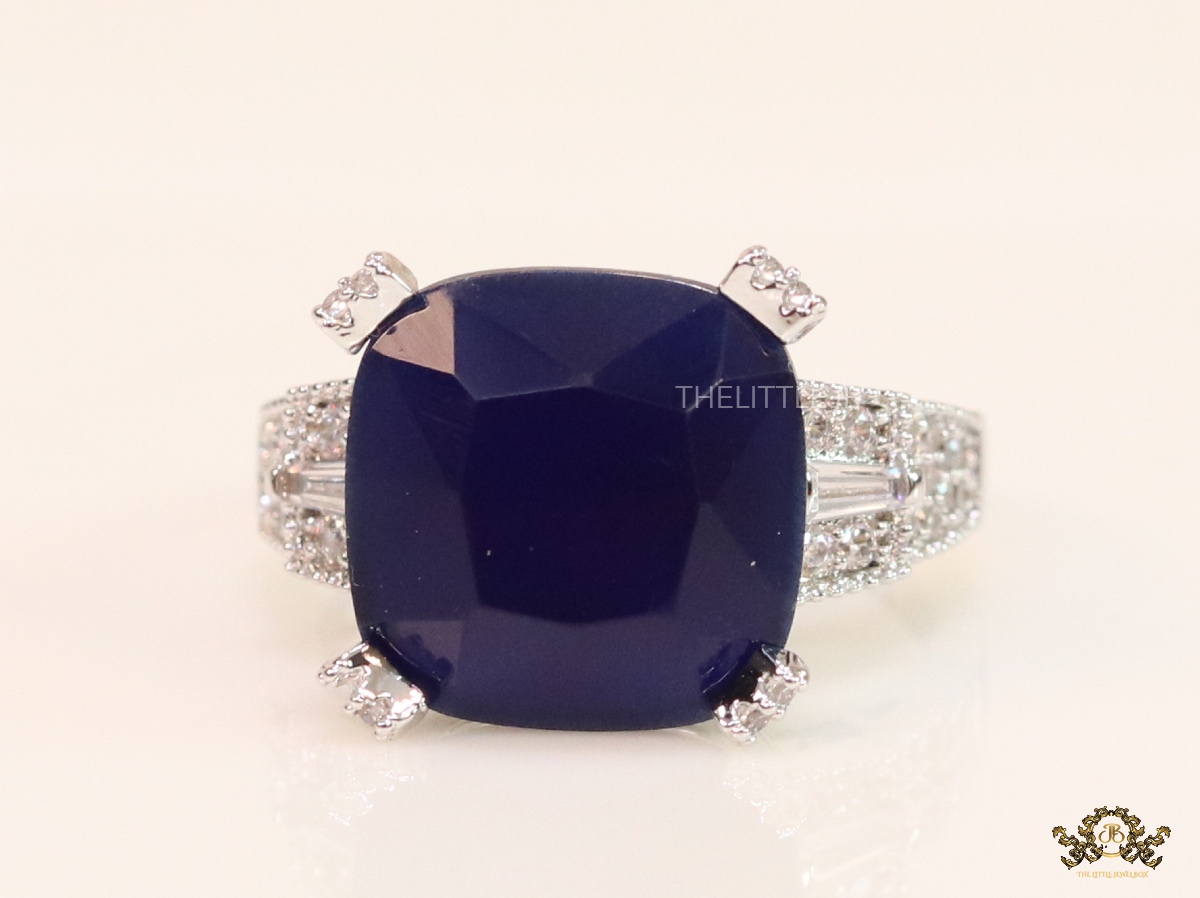 Blue sapphire stone platinum plated ring with cz band