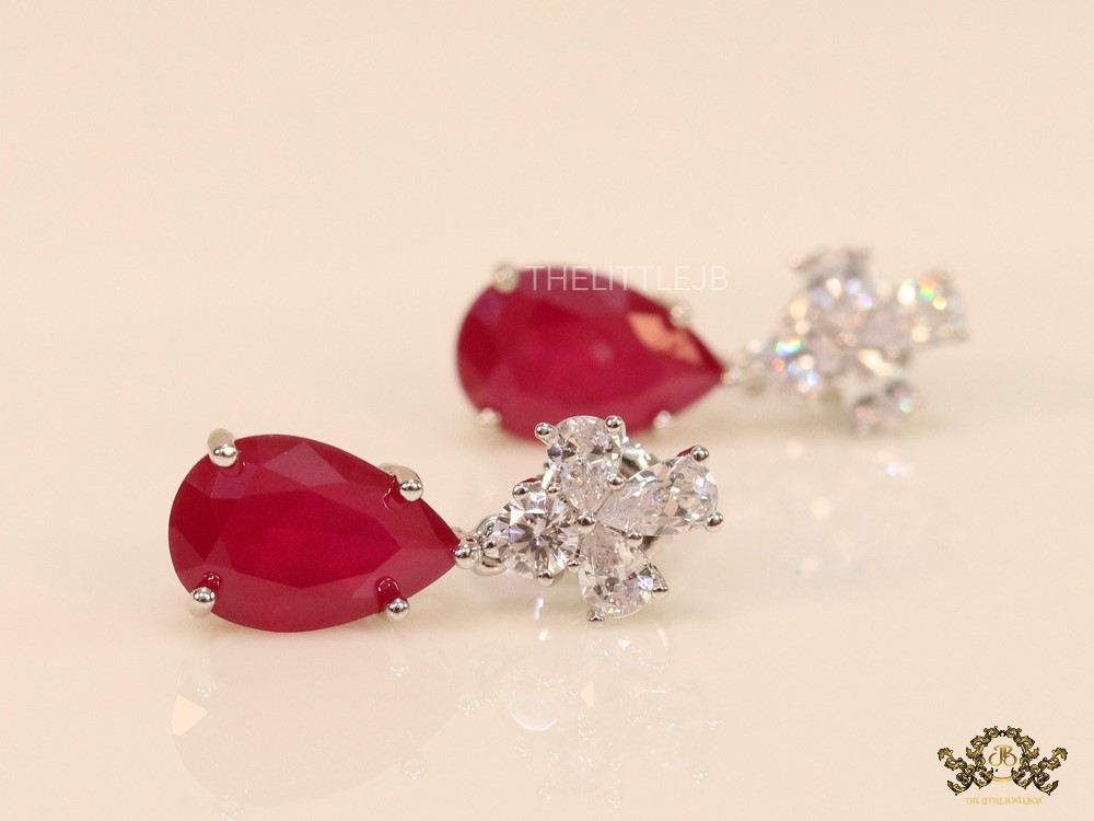 Drop shaped ruby red dangles with big fancy cut cz