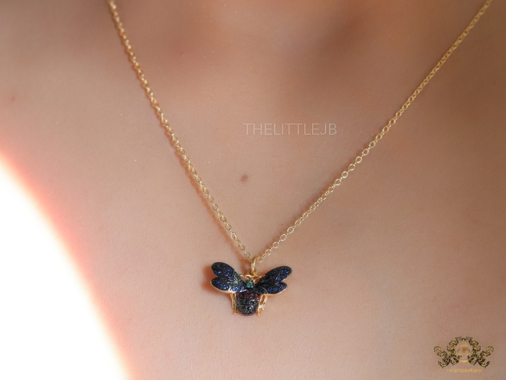 Gold plated glossy black queen bee necklace