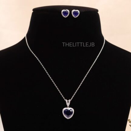 Sapphire blue heart shaped pendant set in platinum finish