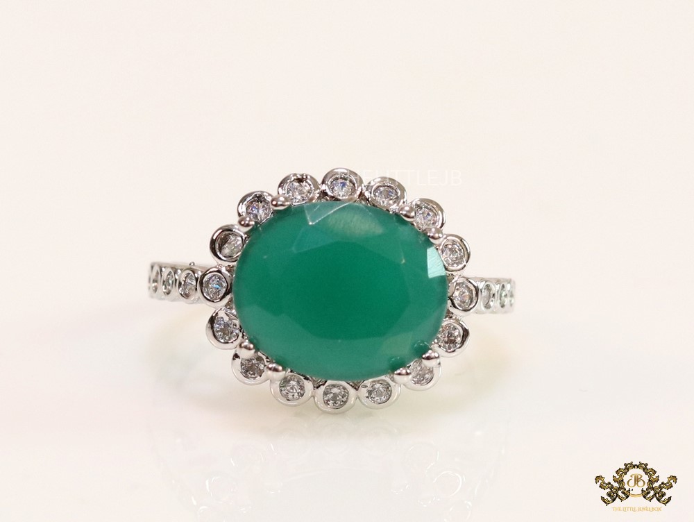 Emerald green stone ring with cz and platinum finish