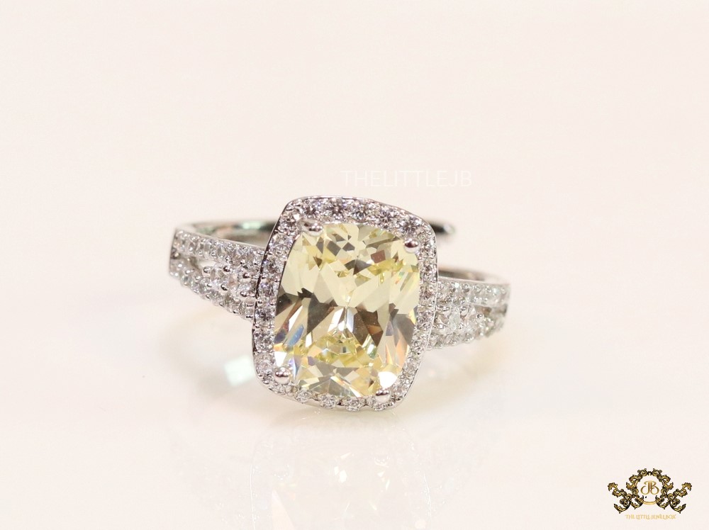 Rectangular yellow coloured stone open ring lined with cz