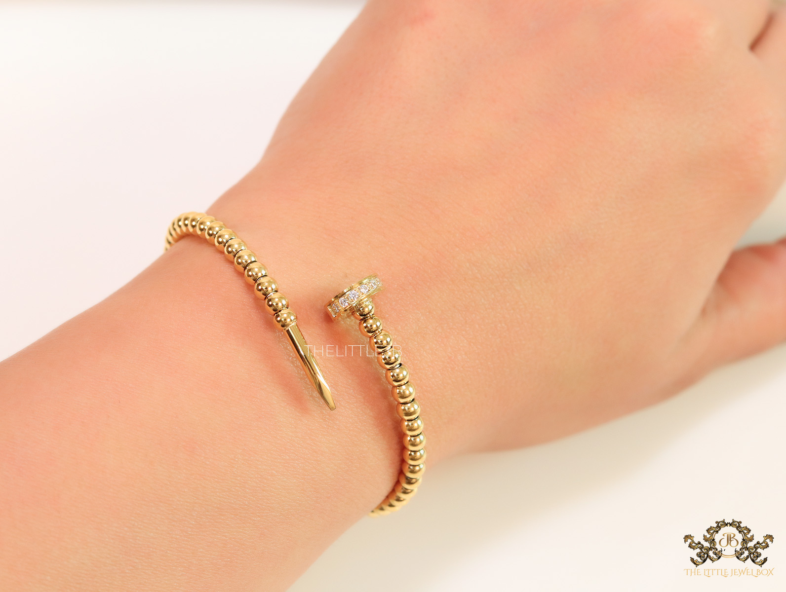 Gold plated openable nail bracelet with cz and metallic beads The Little Jewel Box