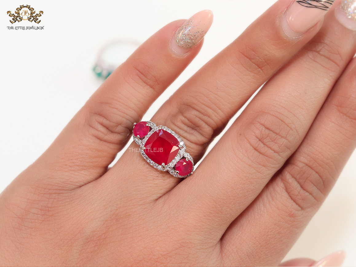 Platinum cz ring with ruby red stones