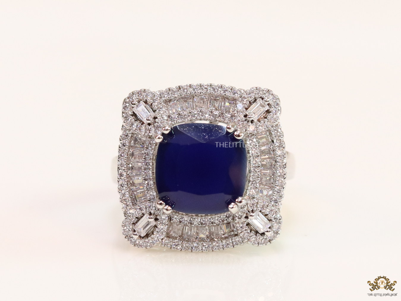 Open Sapphire blue platinum ring with heavy cz border - Image 2