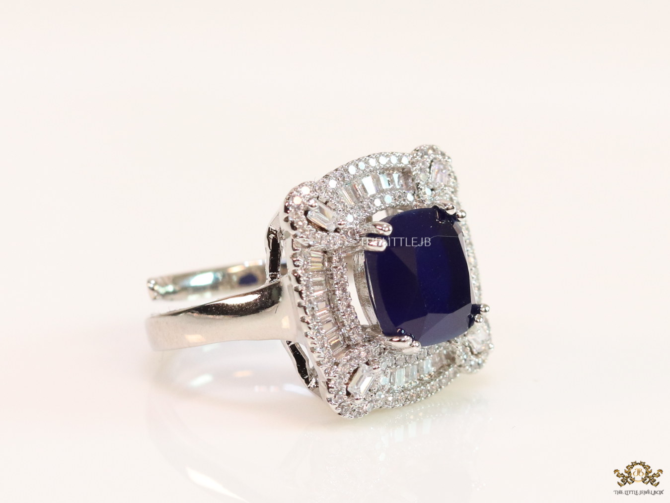 Open Sapphire blue platinum ring with heavy cz border - Image 3