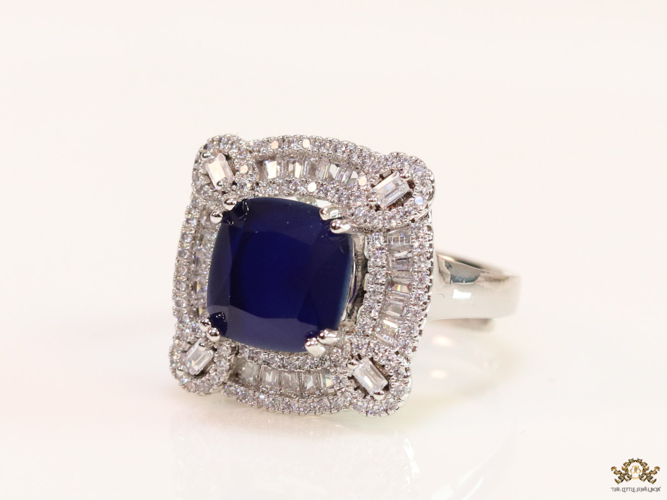 Open Sapphire blue platinum ring with heavy cz border - Image 4