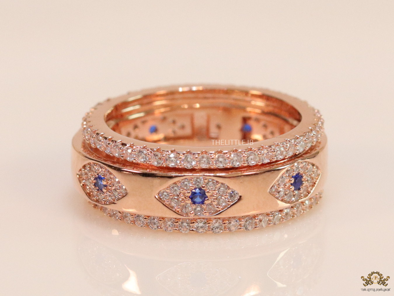 8mm Rotating centre Rose Gold plated band with multiple cz evil eyes - Image 2