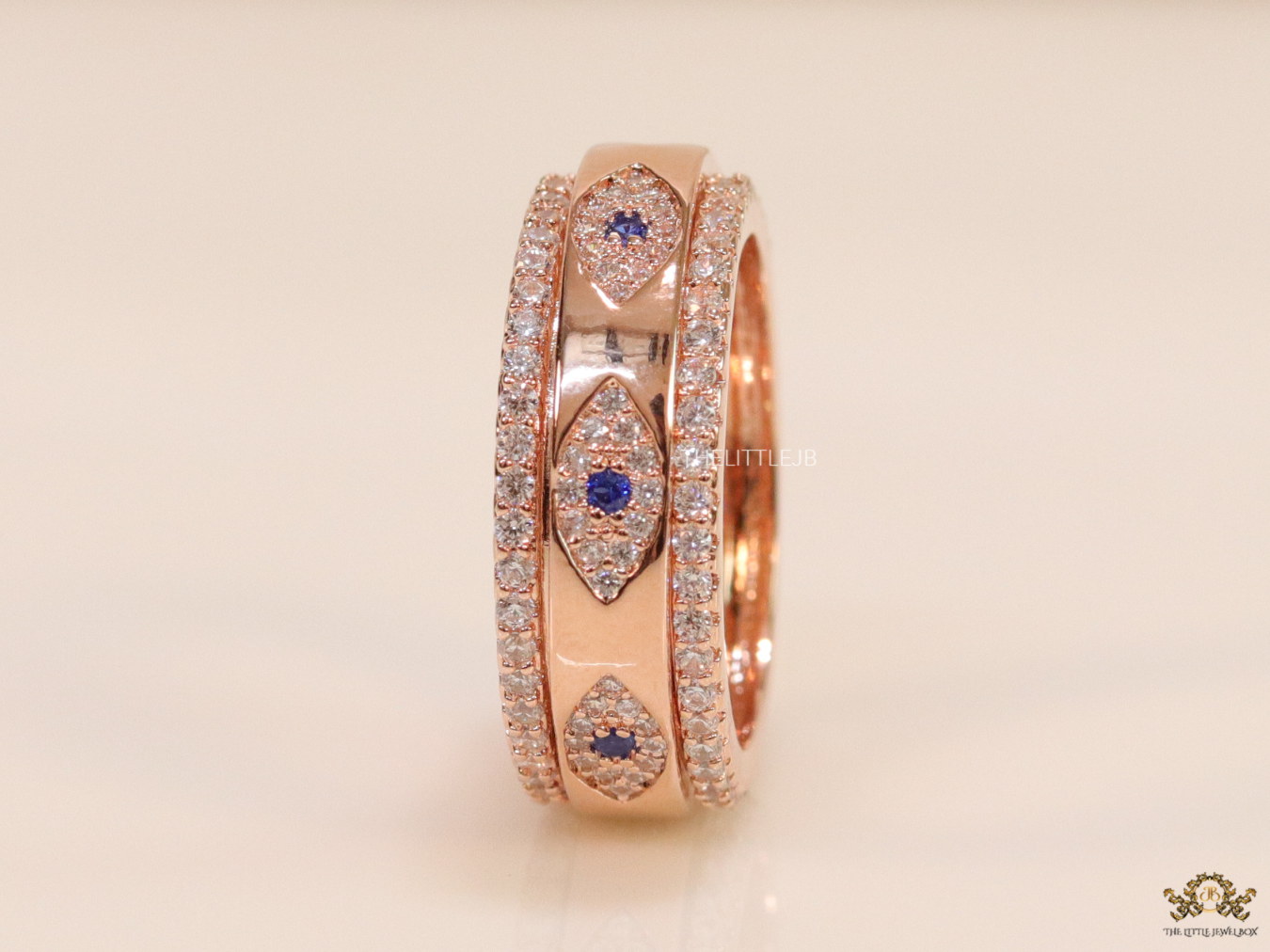 8mm Rotating centre Rose Gold plated band with multiple cz evil eyes - Image 3