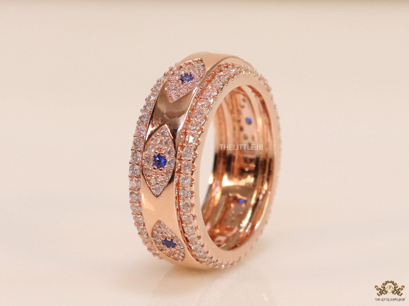 8mm Rotating centre Rose Gold plated band with multiple cz evil eyes - Image 4
