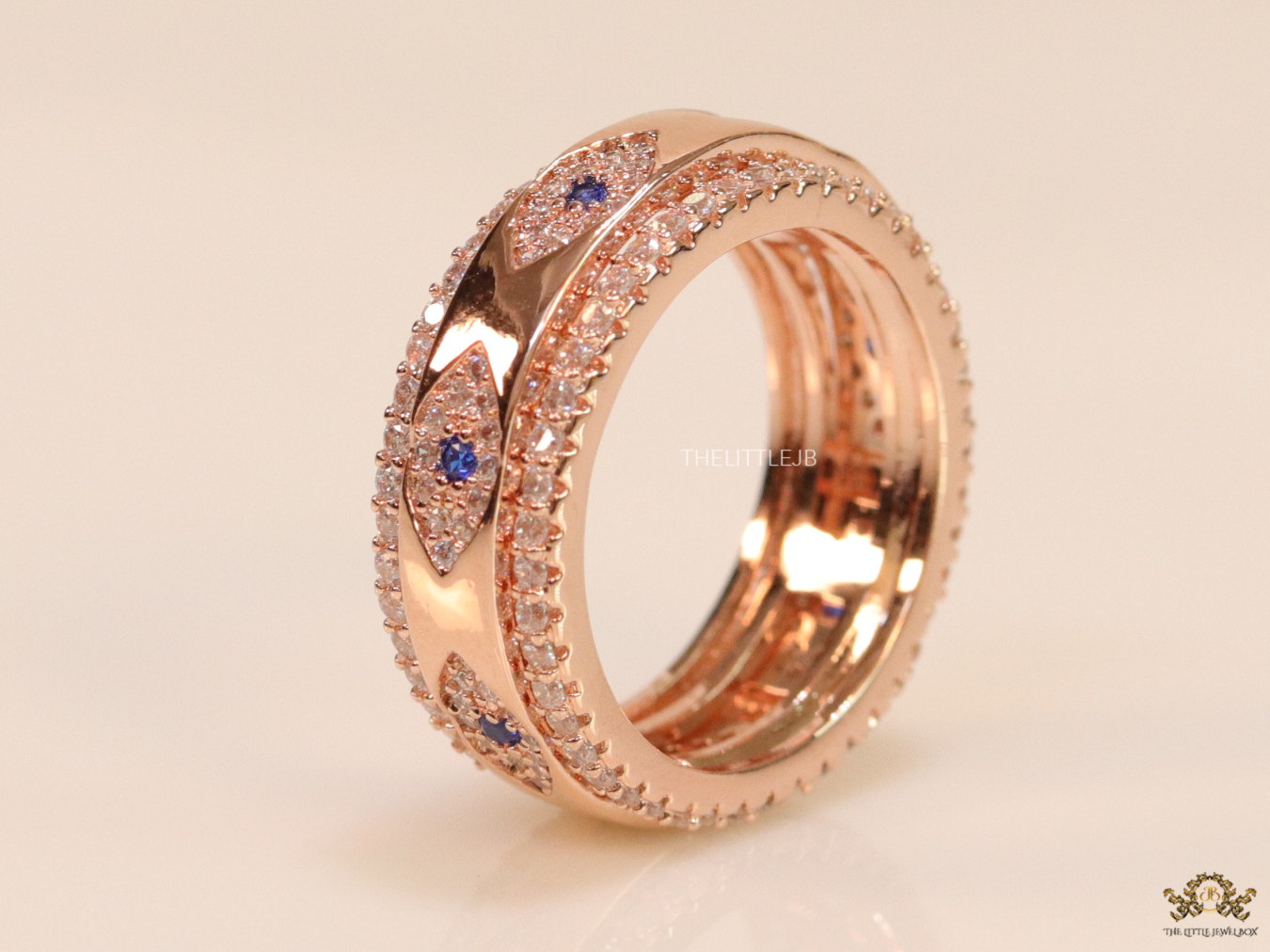 8mm Rotating centre Rose Gold plated band with multiple cz evil eyes - Image 5