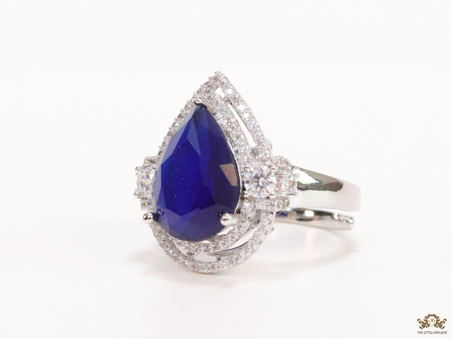 Platinum plated cz open ring with sapphire blue drop stone - Image 2
