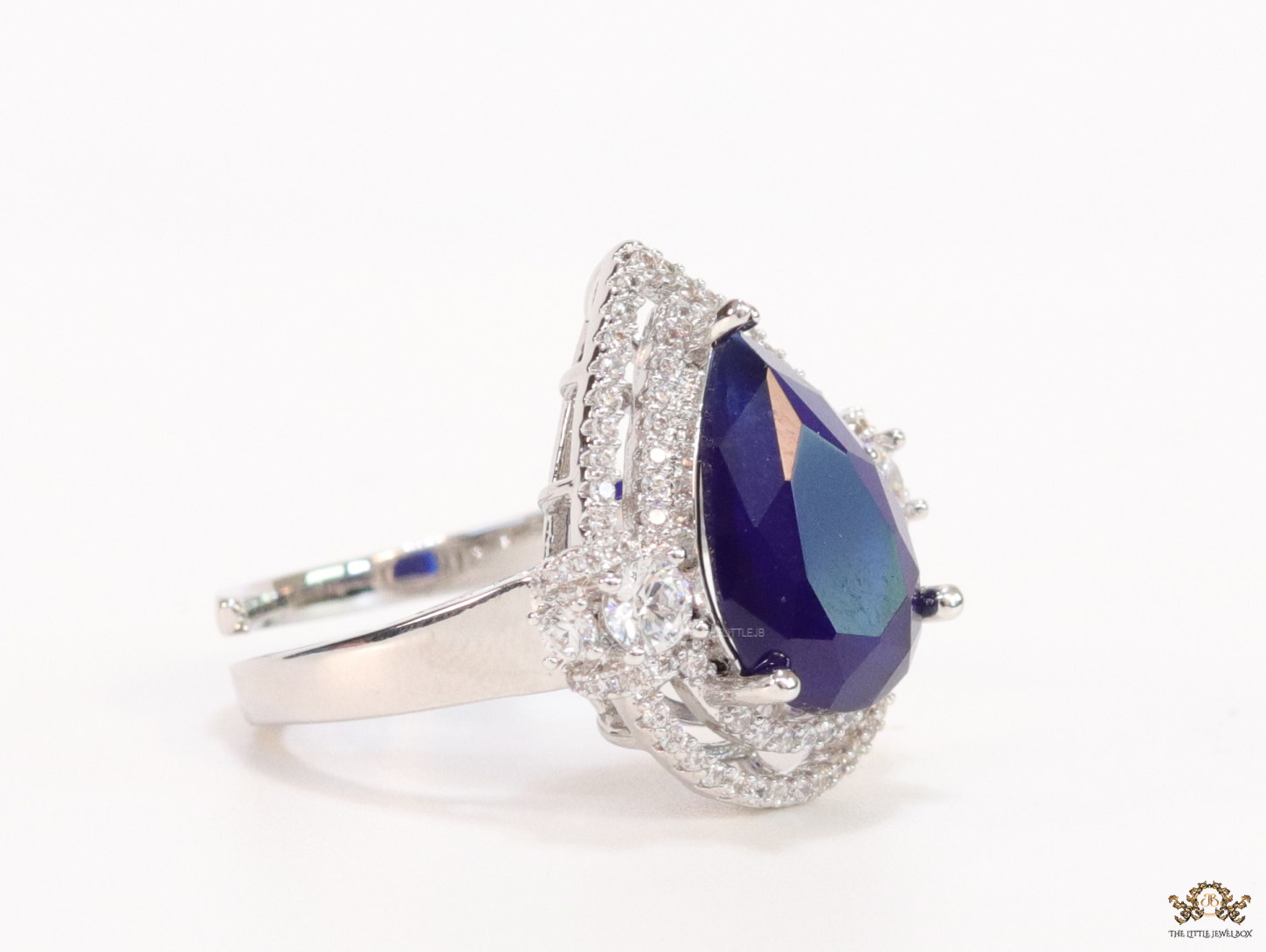 Platinum plated cz open ring with sapphire blue drop stone - Image 3