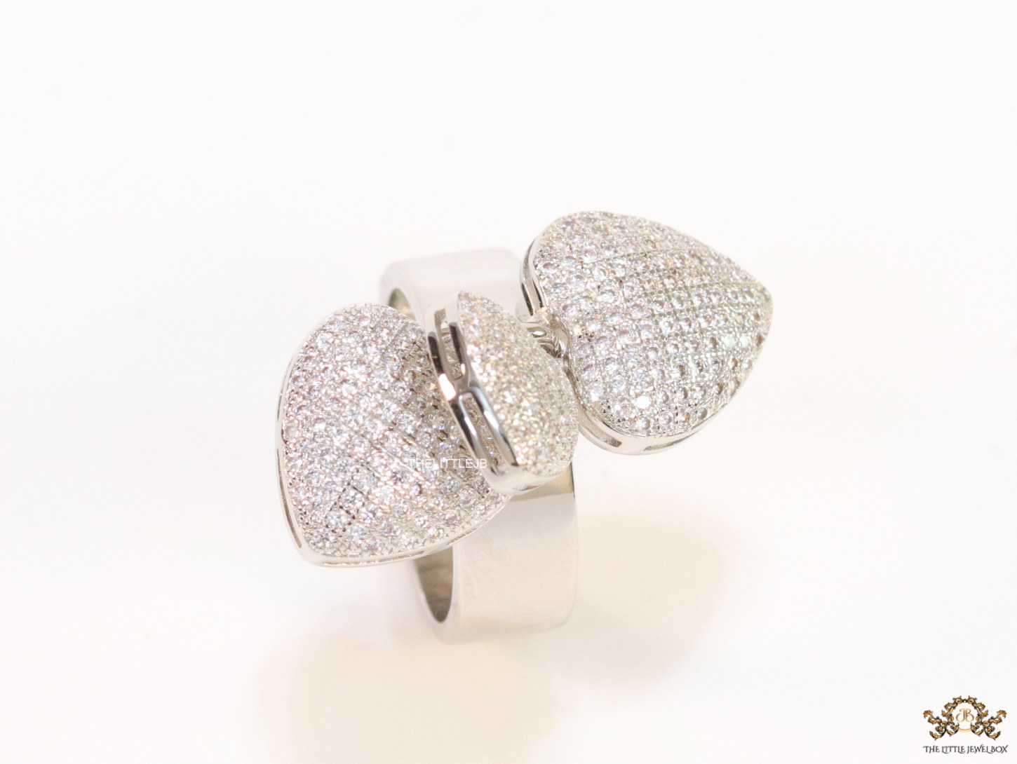 Platinum plated band ring with cz heart charms - Image 4