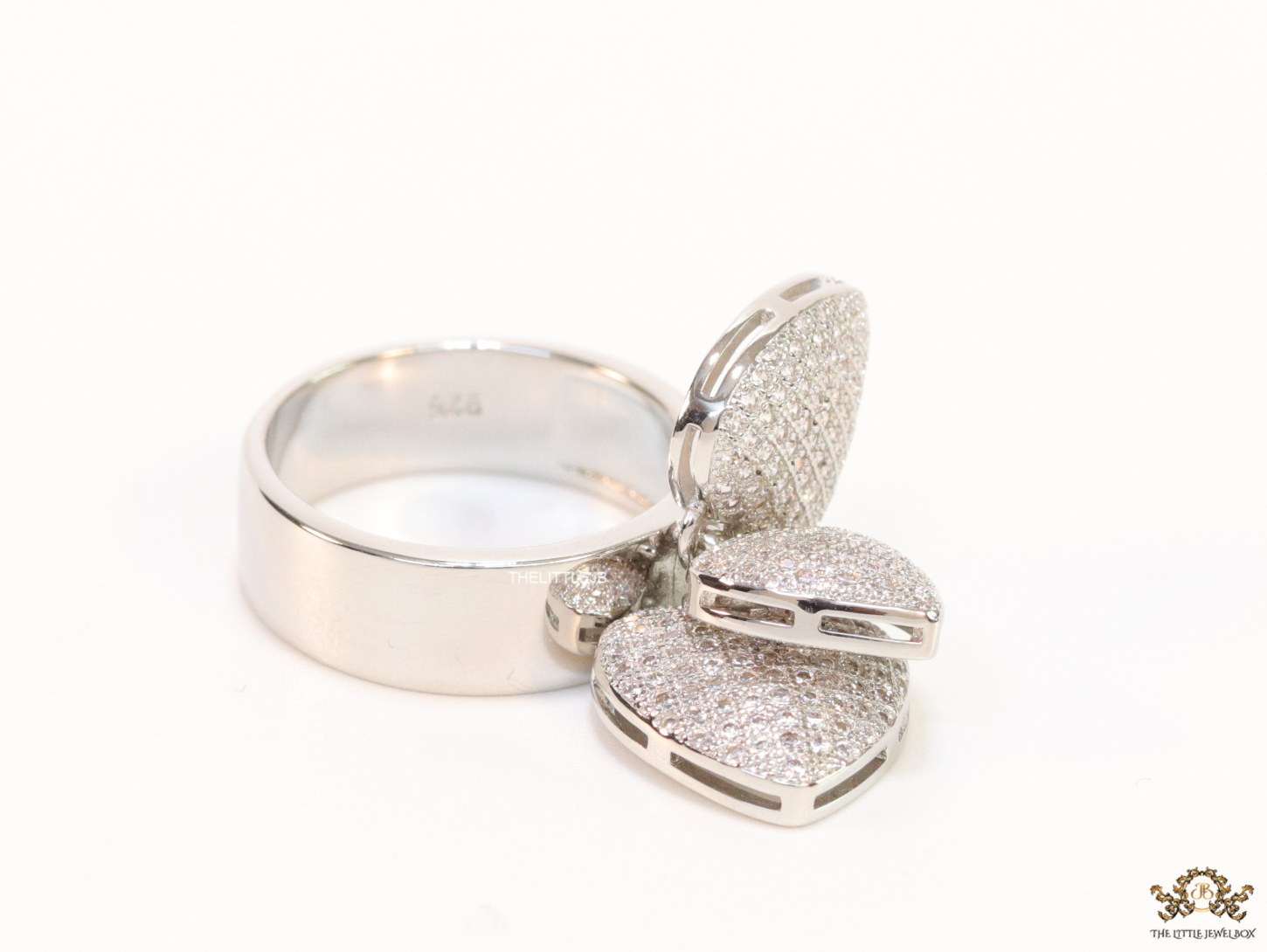 Platinum plated band ring with cz heart charms - Image 2