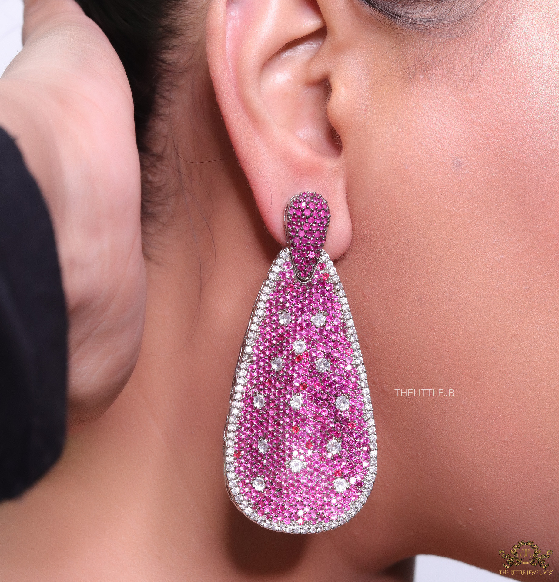 Long pink and white cz earrings in platinum finish