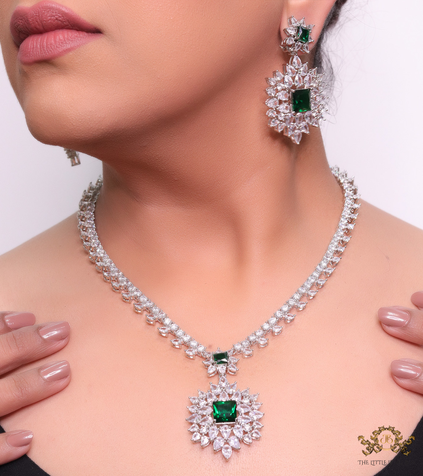 Platinum plated necklace set with fancy cut cz and emerald green stones
