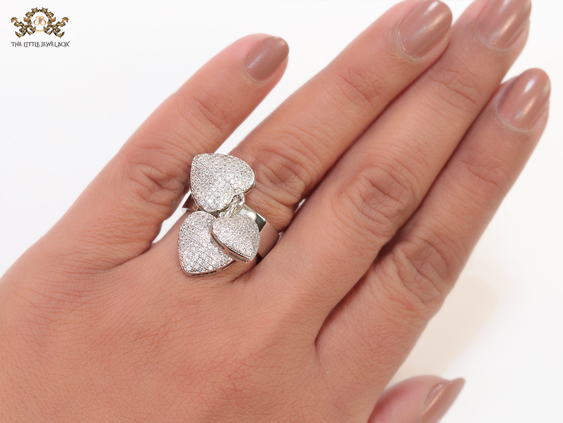 Platinum plated band ring with cz heart charms