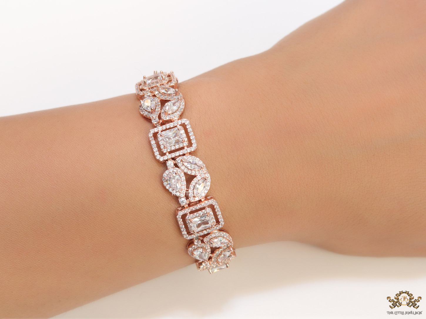 Openable Asymmetrical fancy cut cz bracelet in rose gold finish