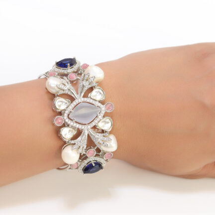 b28 Exclusive pearl and cz bracelet in platinum finish with sapphire blue and soft grey stones