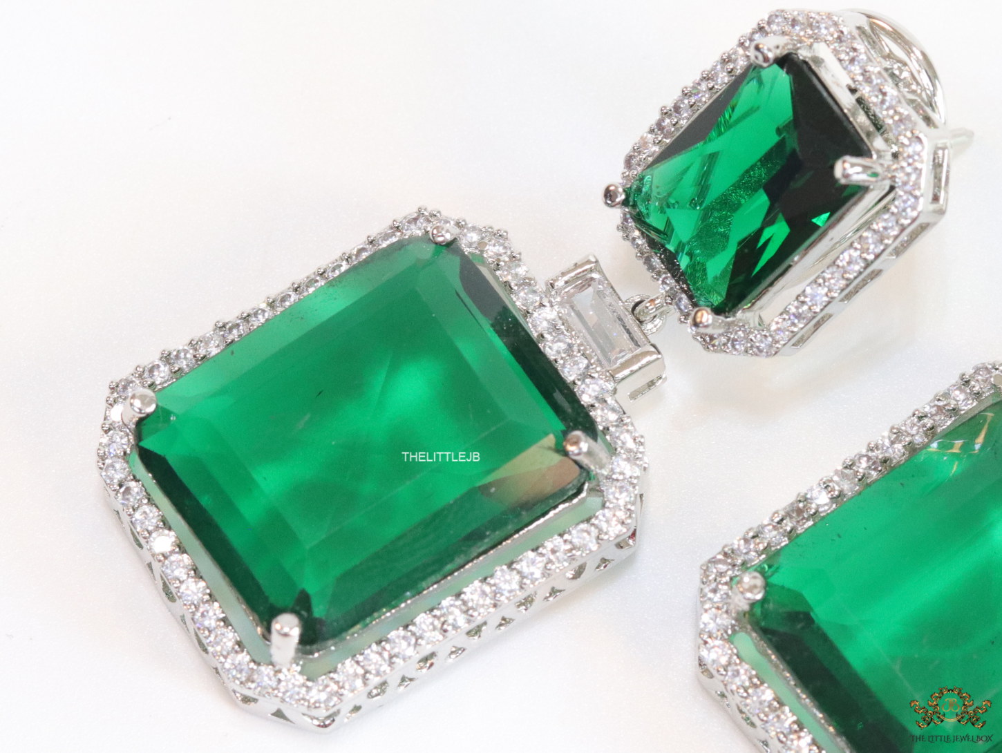 Emerald green drop platinum earrings with cz lining - Image 3