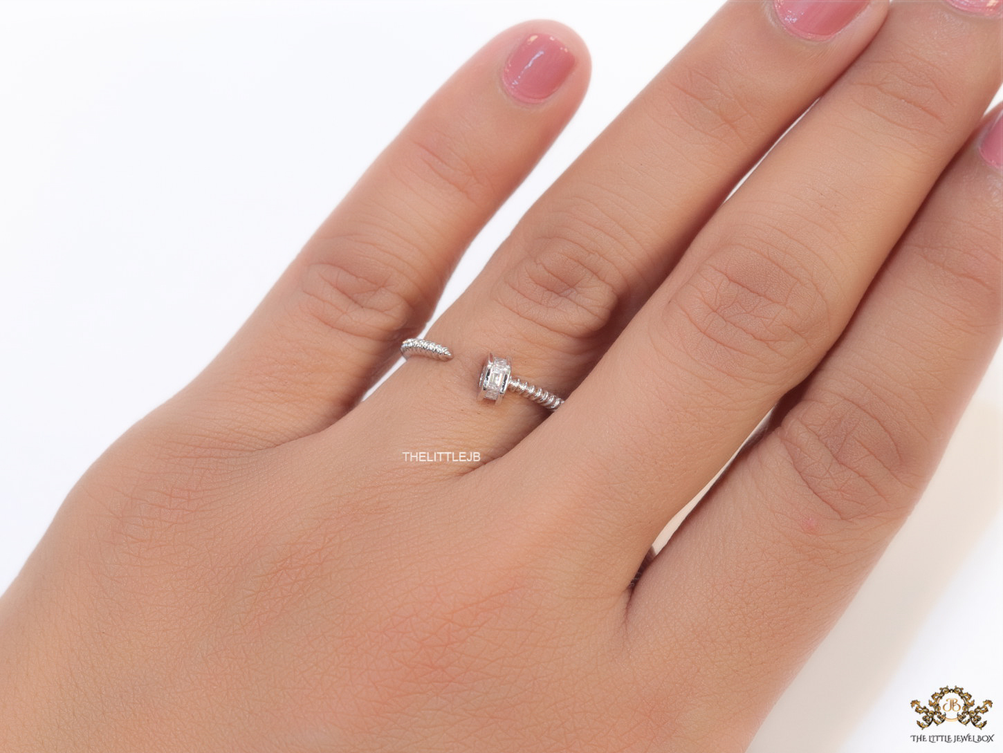Top open silver nail shape ring with cz stones