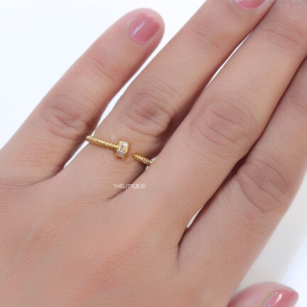 r46 Top open golden nail shape ring with cz stones