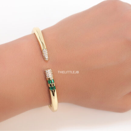 b9 Top open gold plated bracelet with cubic zirconia stones and emerald green colour details