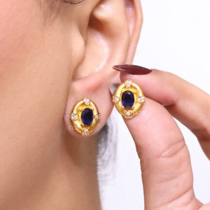 Gold studs with sappire centre and cz