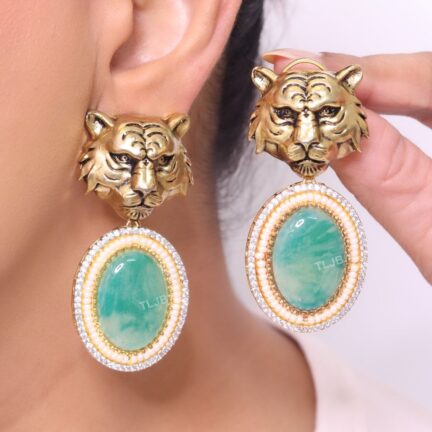 Antique tiger face with cloudy green stone