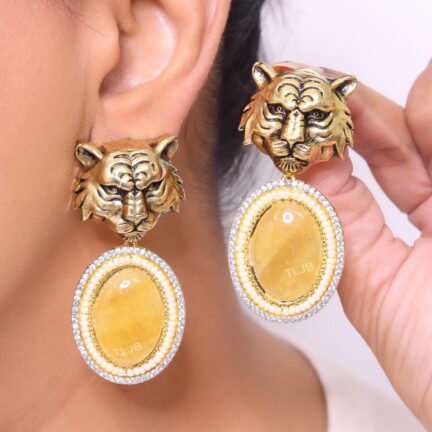 Antique tiger face with yellow stone.