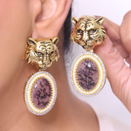 Antique tiger face with amethyst stone.