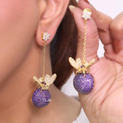 Butterfly motif and half ball danglers in purple cz