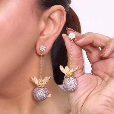 Butterfly motif and half ball danglers in grey cz