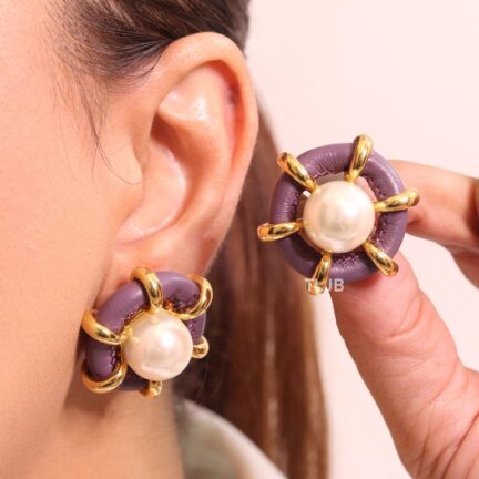 Pearl and lilac leather statement studs