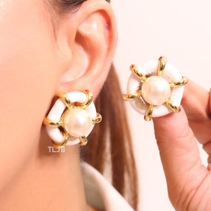 Pearl and white leather statement studs