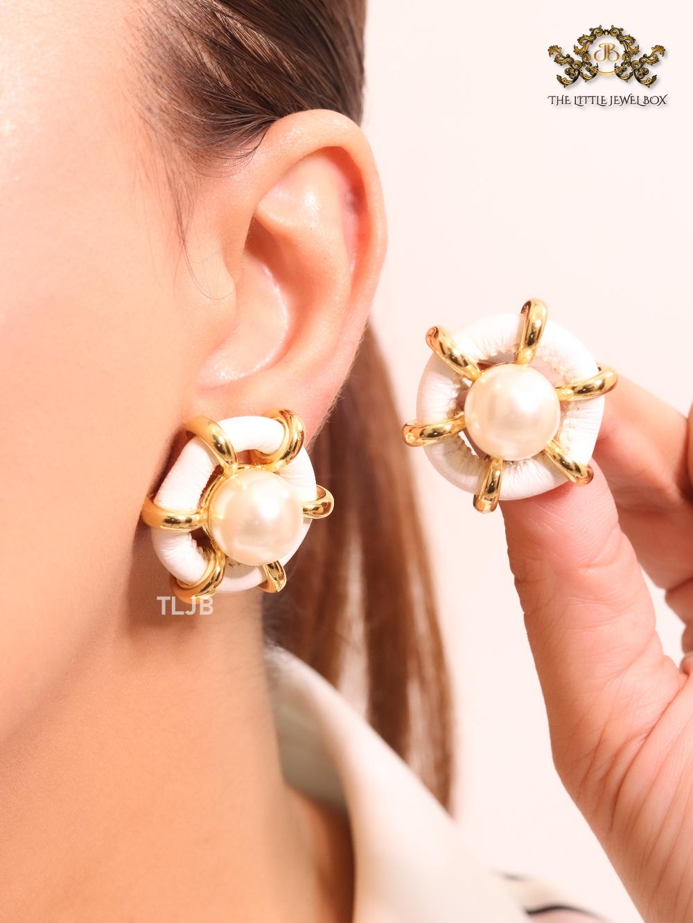 Pearl and white leather statement studs