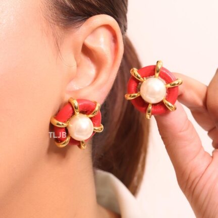 Pearl and red leather statement studs