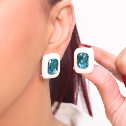 White enamel and blue stone studs