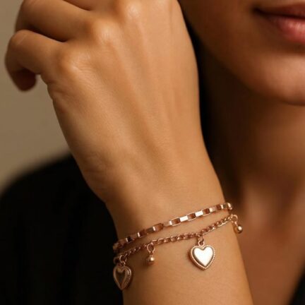 Adjustable golden two layered link chain bracelet with heart motifs