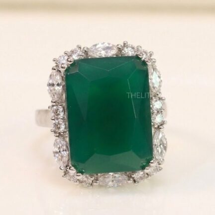 image_1775652196923 Adjustable green sapphire ring in platinum finish lined with cz