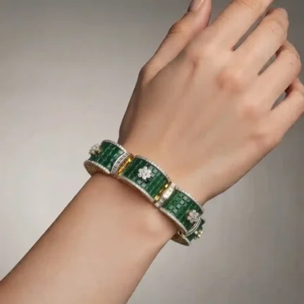 Princess cut emerald color cz invisibly set to form a flower bangle shaped bracelet with white cz outlined and flower motifs