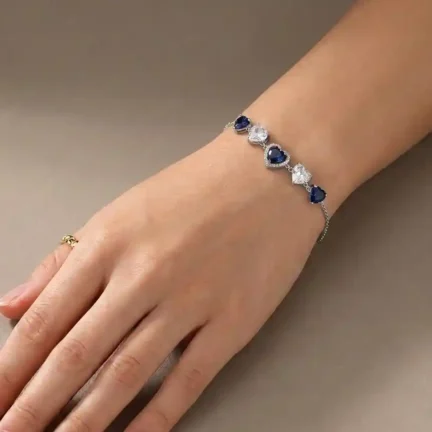 TLJB-L151-025-BR-1 Platinum Plated Tapered Blue and Clear Heart CZ Adjustable Link Chain Bracelet